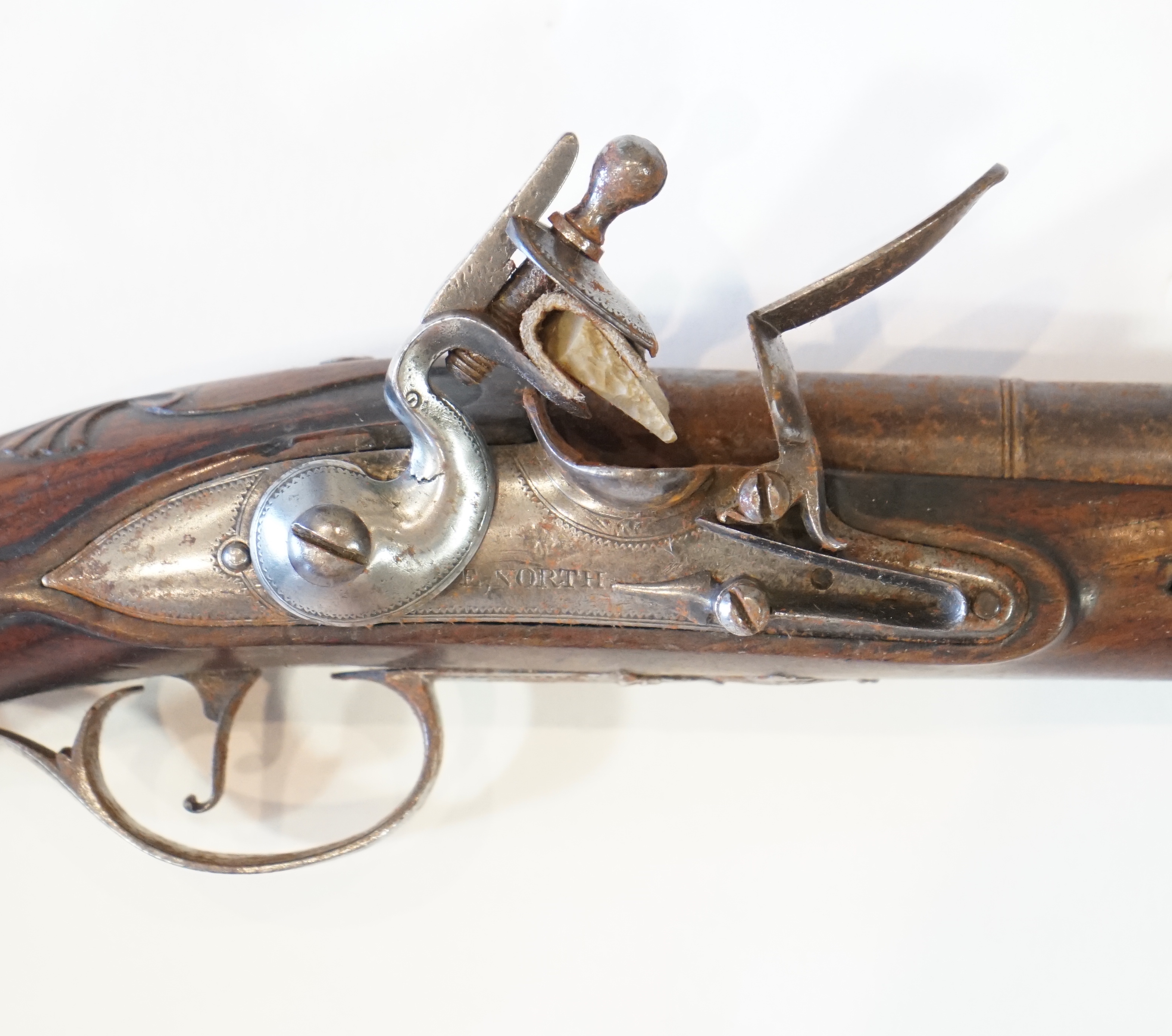 A partly silver mounted flintlock holster pistol by E. North of London, c.1760